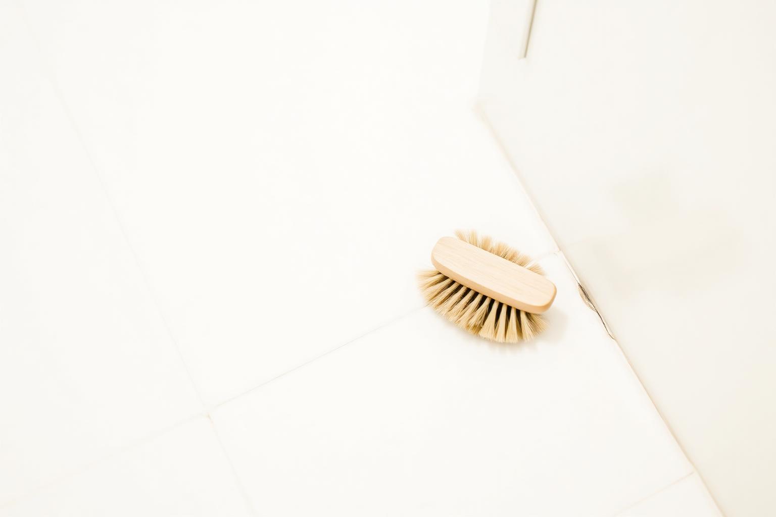 Bright white bathroom tile floor with crisp clean grout lines